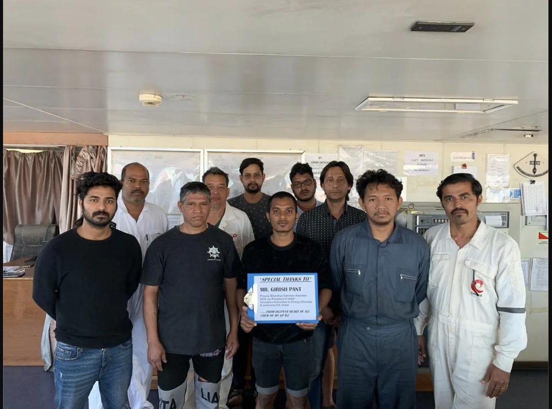 Ship crew group photo holding a special thanks sign for Mr. Girish Pant